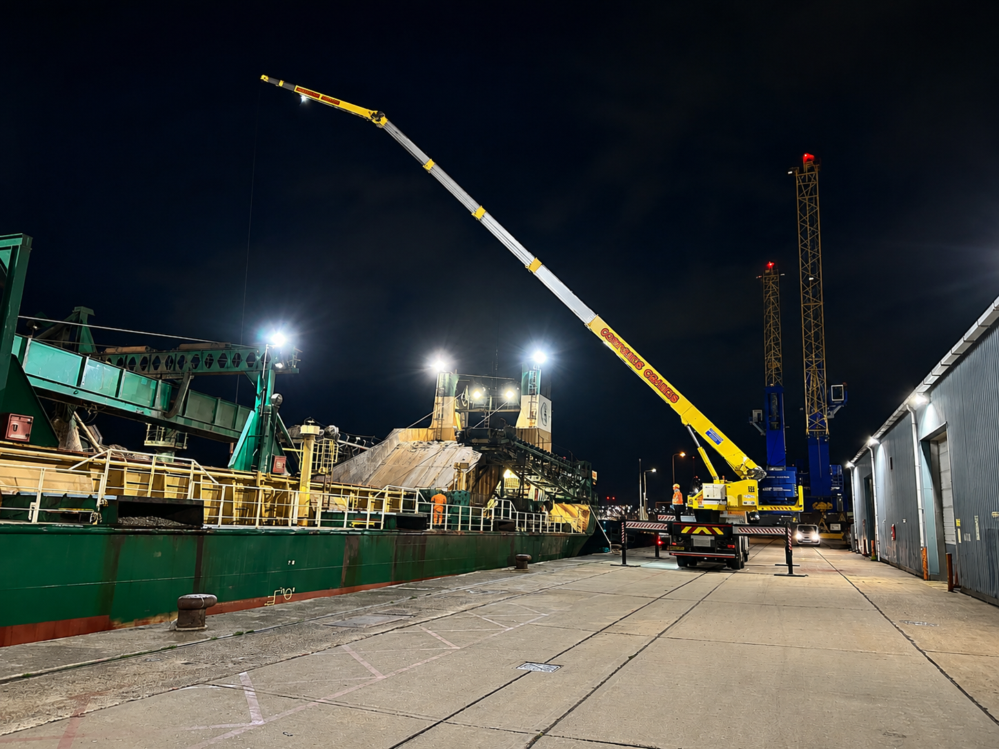 Liftec mobile crane working alongside a ship at night