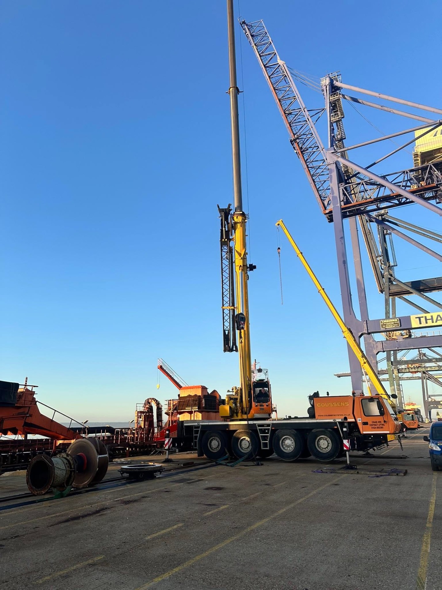 Coussens mobile crane on the quayside beside ship-to-shore gantries